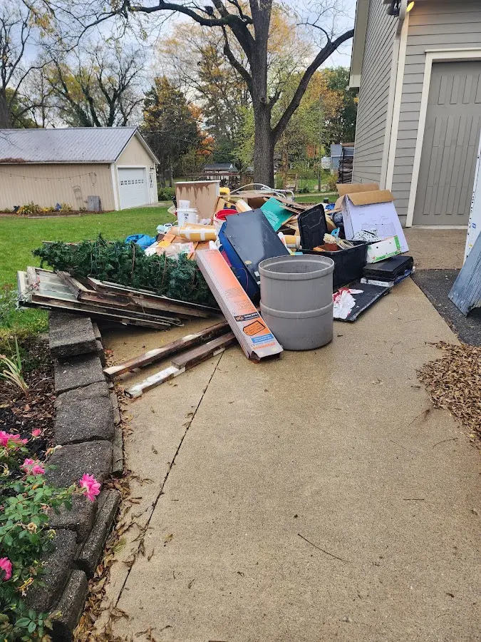 Dumpster being loaded with debris for Demolition Dumpster Rental in Carmi